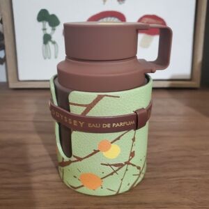 Odyssey Eau de Parfum with Brown and Green Design